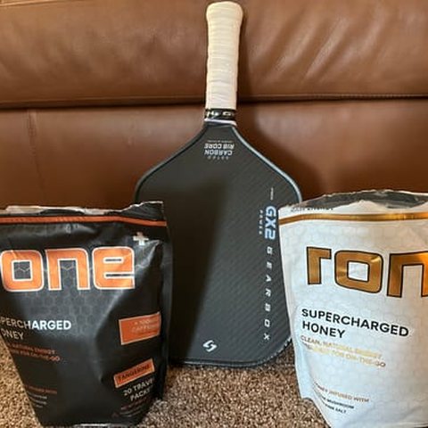 RONE bags next to a pickleball paddle