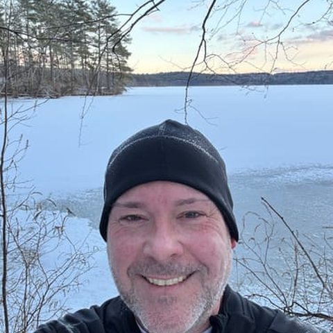 Trail runner by a frozen lake